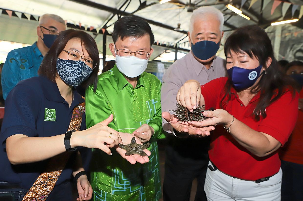 Visitors taking a closer look at an exhibit of discarded plastic. — Photos: LIM BENG TATT/The Star