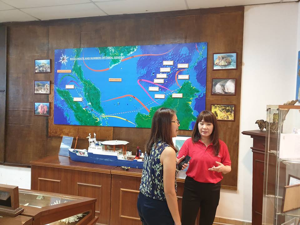 Prof. Aileen explaining to Lyne, Sr. Manager of InvestPenang about their expidition to the Sabah waters around the Spratly Islands to collect marine specimens. The model of the research vessel MV Allied Commander can be seen underneath the postal of the expedition route. The life of a marine scientist can be quite exciting